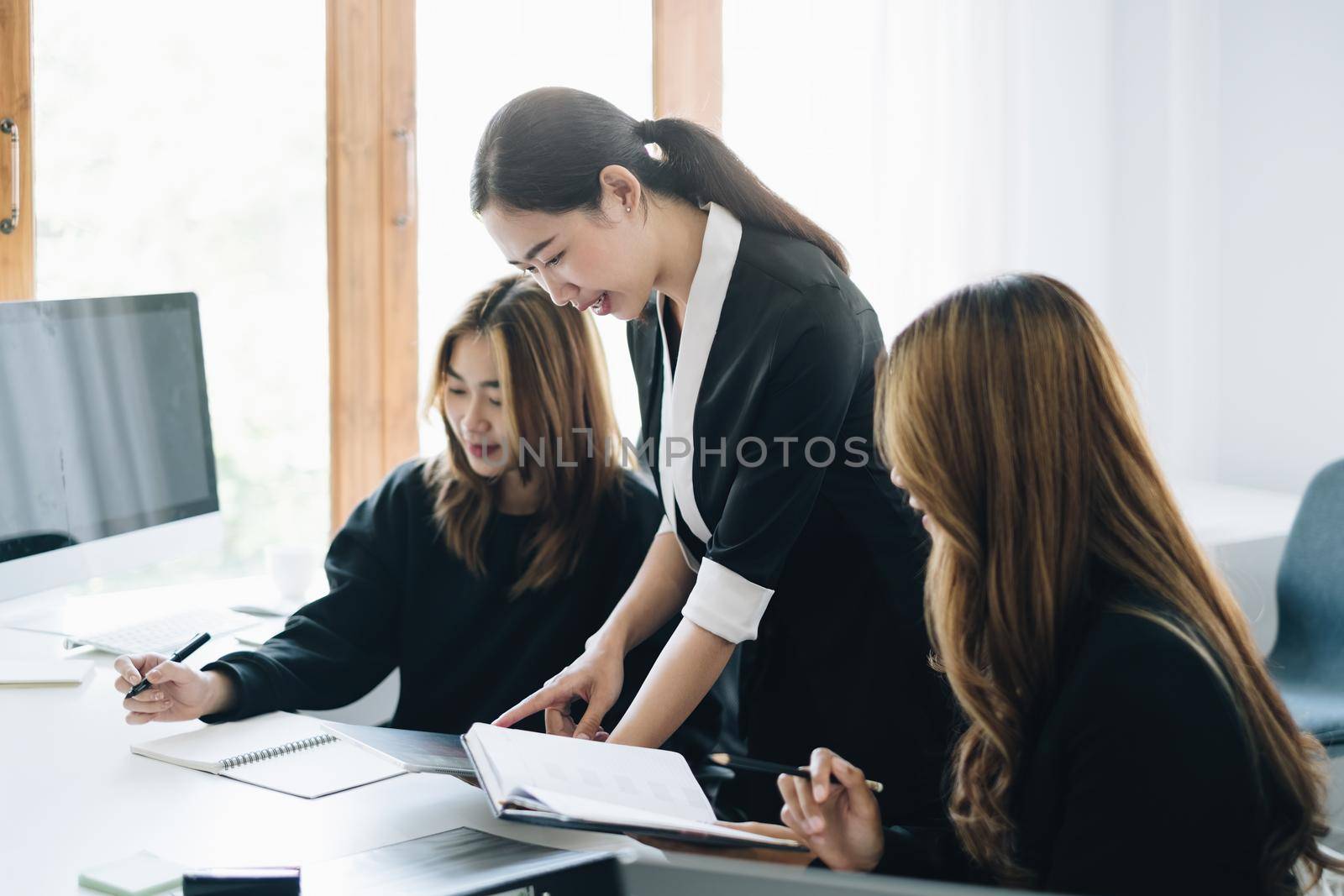 Group of Businesswoman and Accountant consulting budget and planing marketing of company in office. Meeting and Brainstorm finance concept. by itchaznong