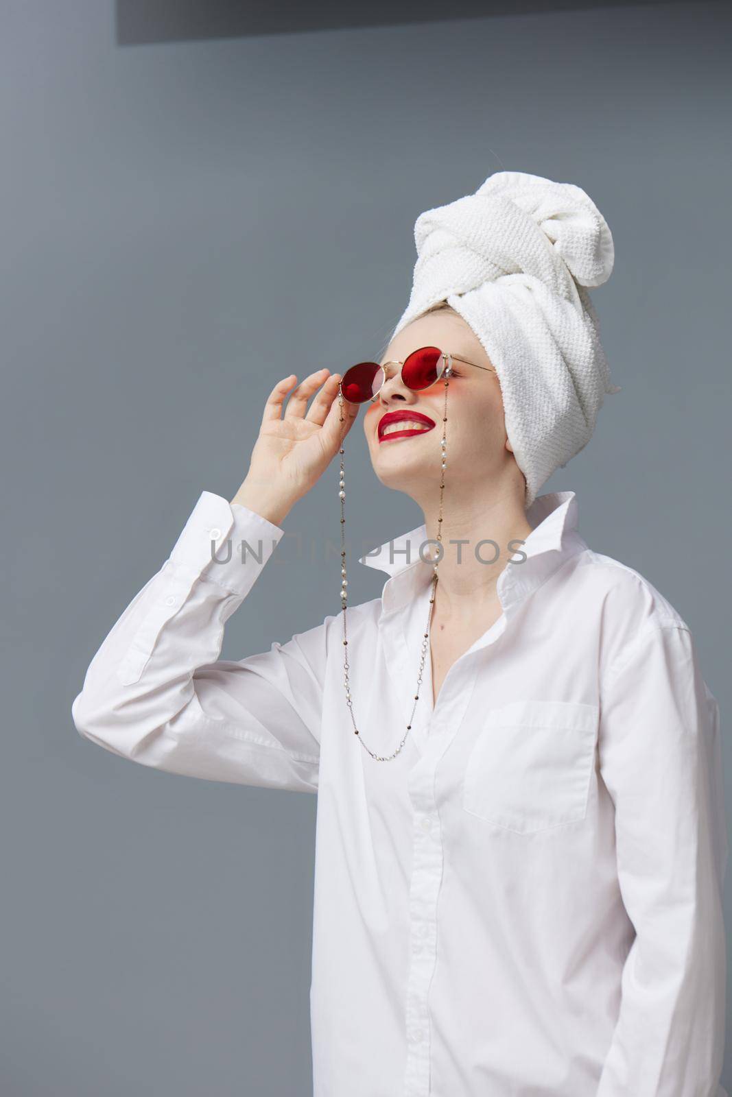 woman red sunglasses cosmetics with towel on head studio model unaltered by SHOTPRIME