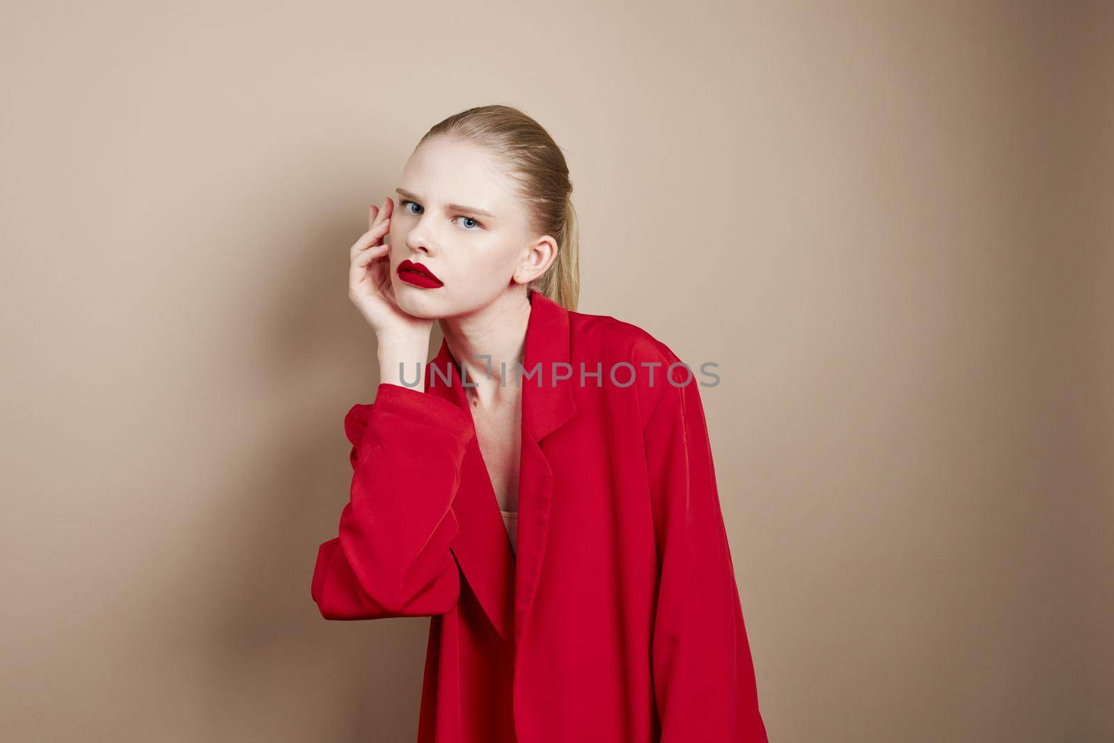 glamorous woman makeup in red jacket studio model unaltered. High quality photo