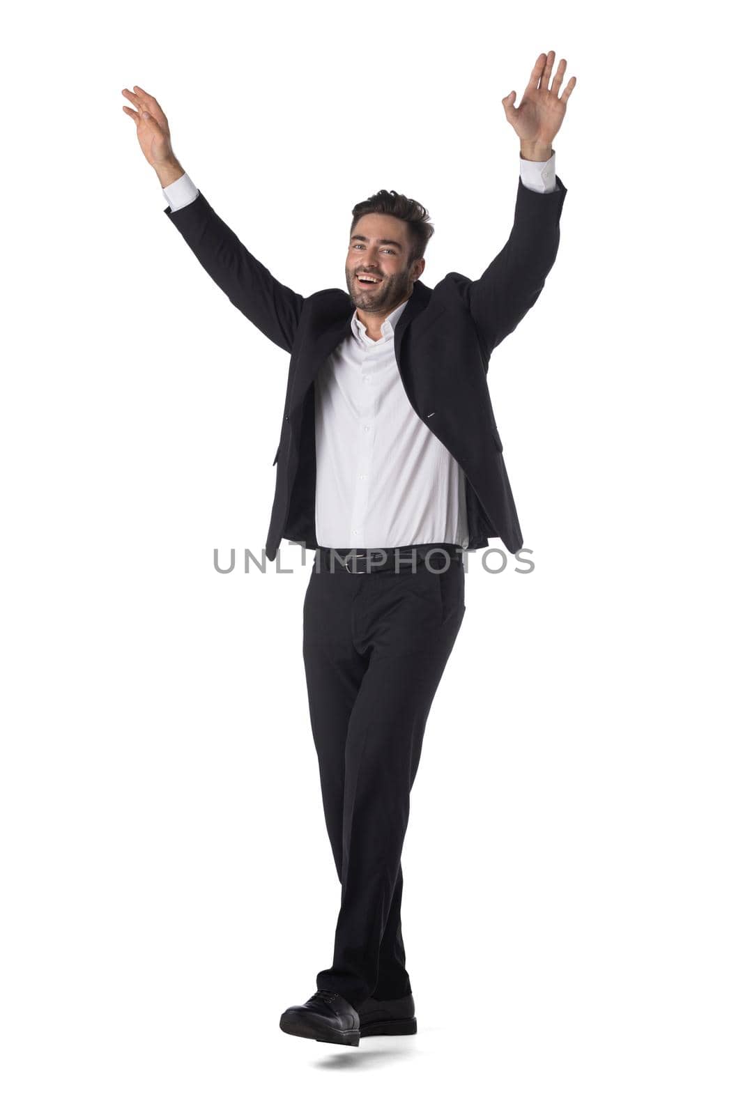 Happy businessman with arms up by ALotOfPeople