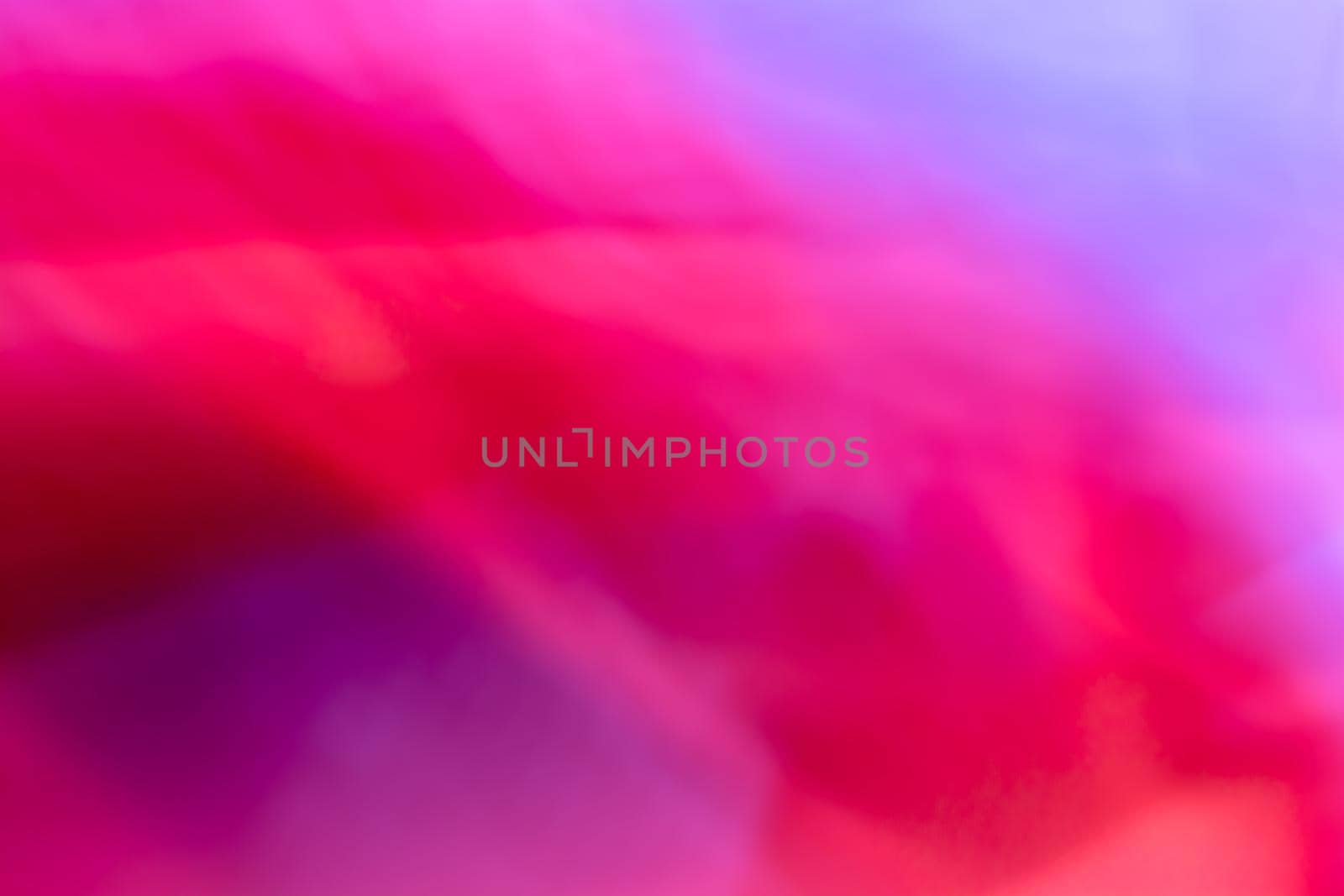 Dynamic red purple lilac abstract background. The backdrop is multicolored with a gradient. A soft transition from one color to another.