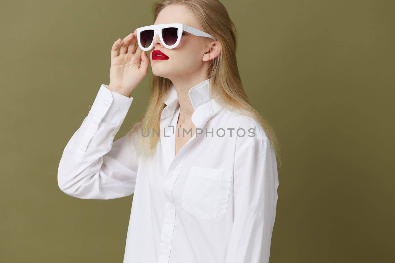 fashionable woman in white shirt sunglasses isolated background by SHOTPRIME
