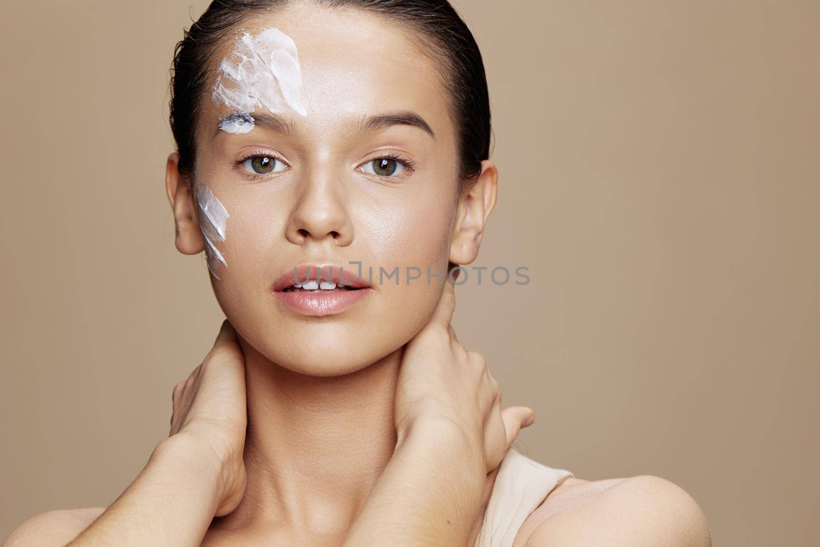 portrait woman skin care by using white mask on the face isolated background by SHOTPRIME