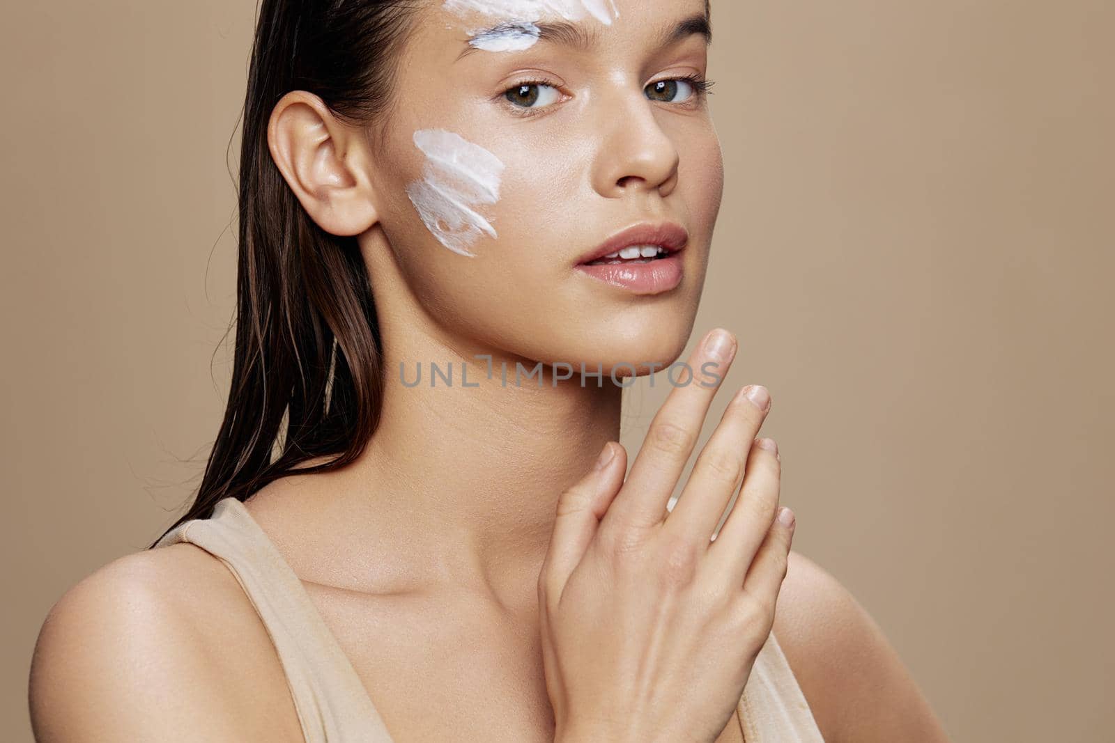 portrait woman applying a soothing face mask cosmetic close-up make-up by SHOTPRIME