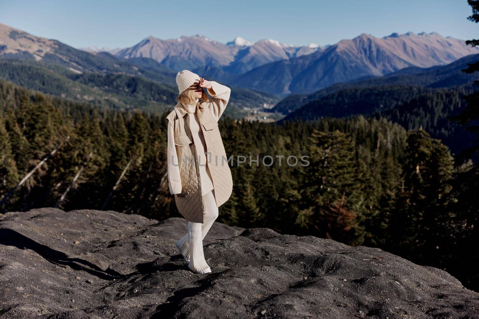 tourist Standing on the edge of a cliff nature travel relaxation. High quality photo