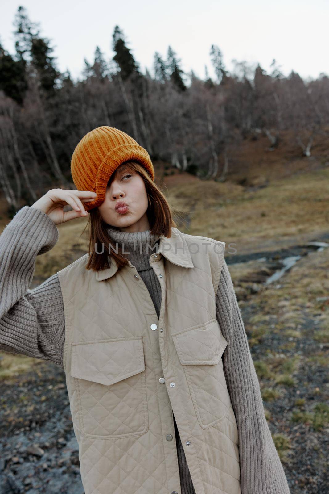 young woman in the autumn forest walk fresh air travel life style. High quality photo