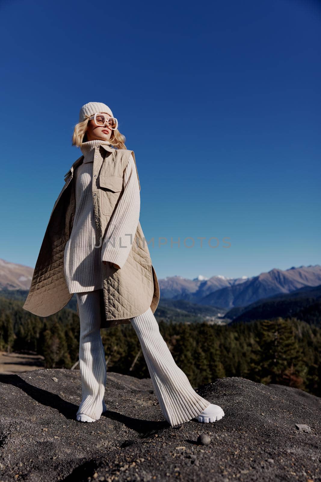 tourist standing on the top of the mountain forest relaxation. High quality photo