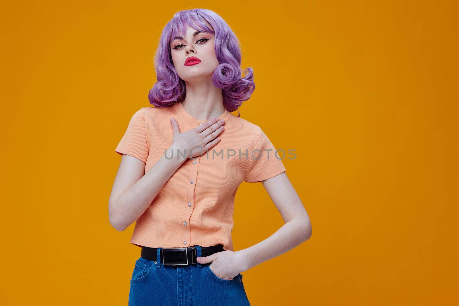 Portrait of a charming lady stylish clothes posing emotions cosmetics hairstyle color background unaltered. High quality photo