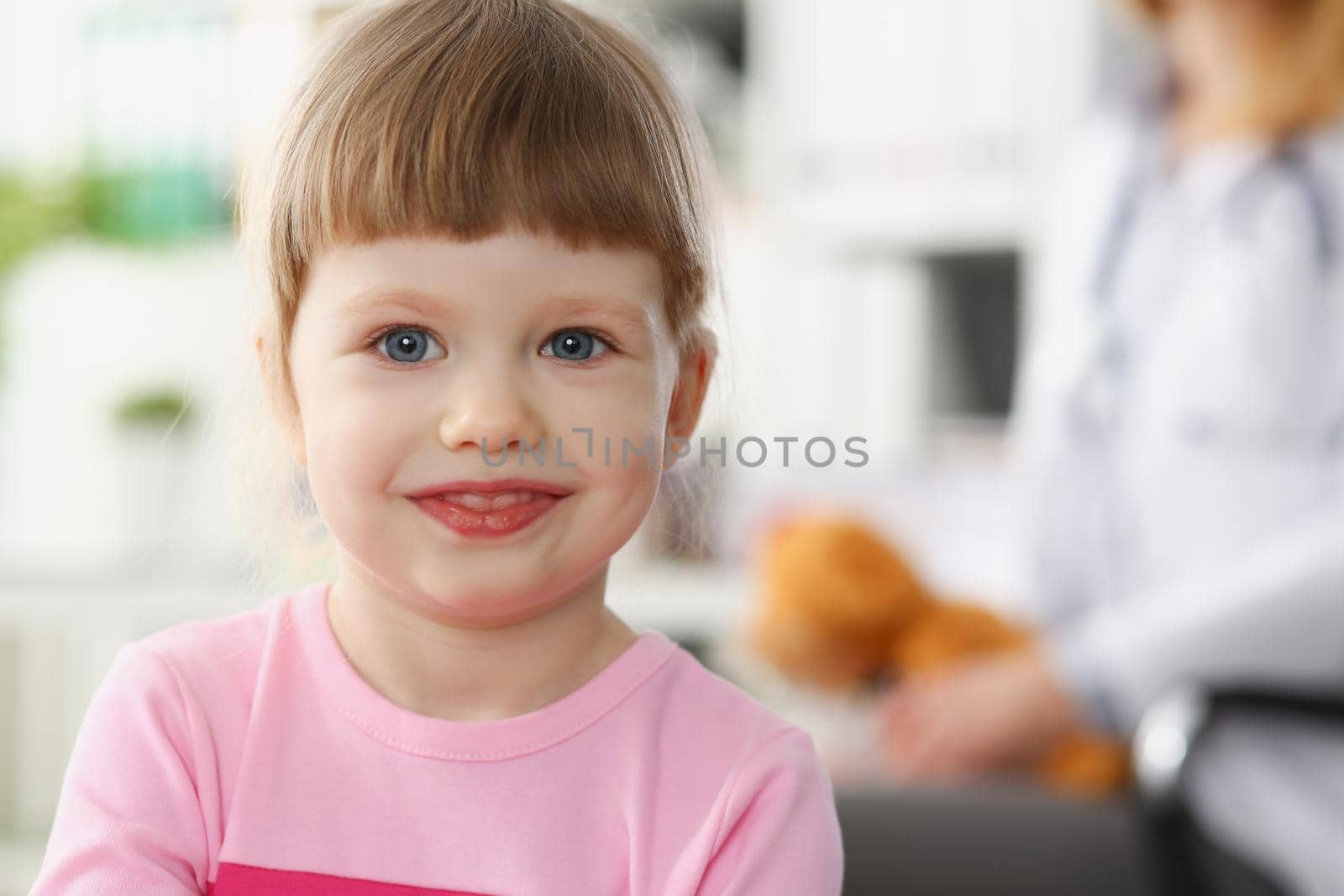 Little child at pediatrician reception, physical exam appointment by kuprevich
