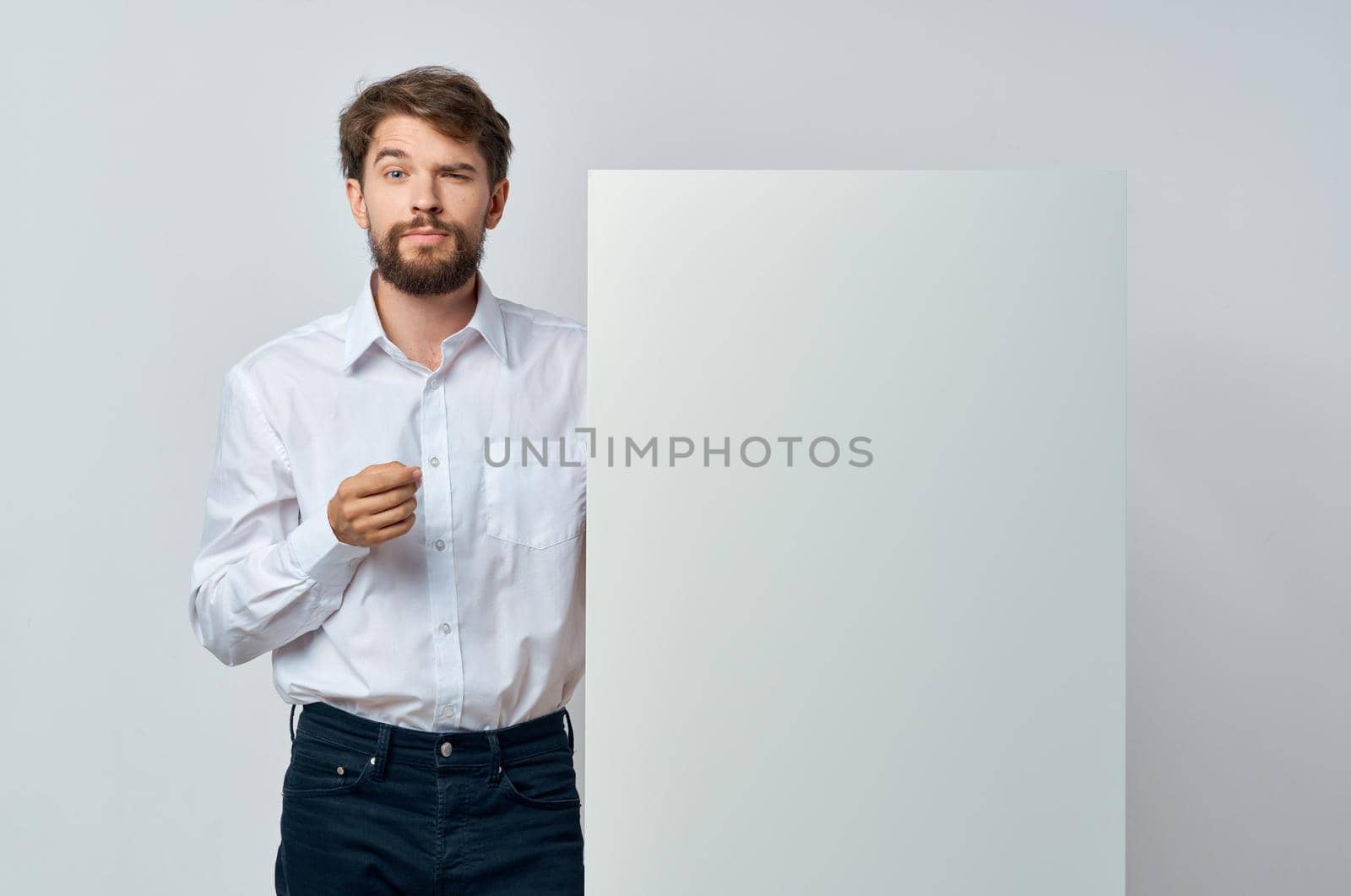 Cheerful man in a white t-shirt mocap poster discount advertising isolated background. High quality photo