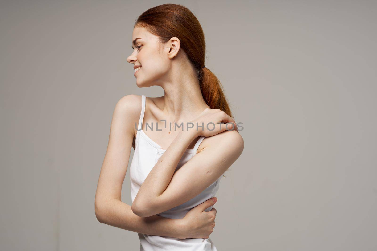 woman kneads shoulders and back joint pain. High quality photo