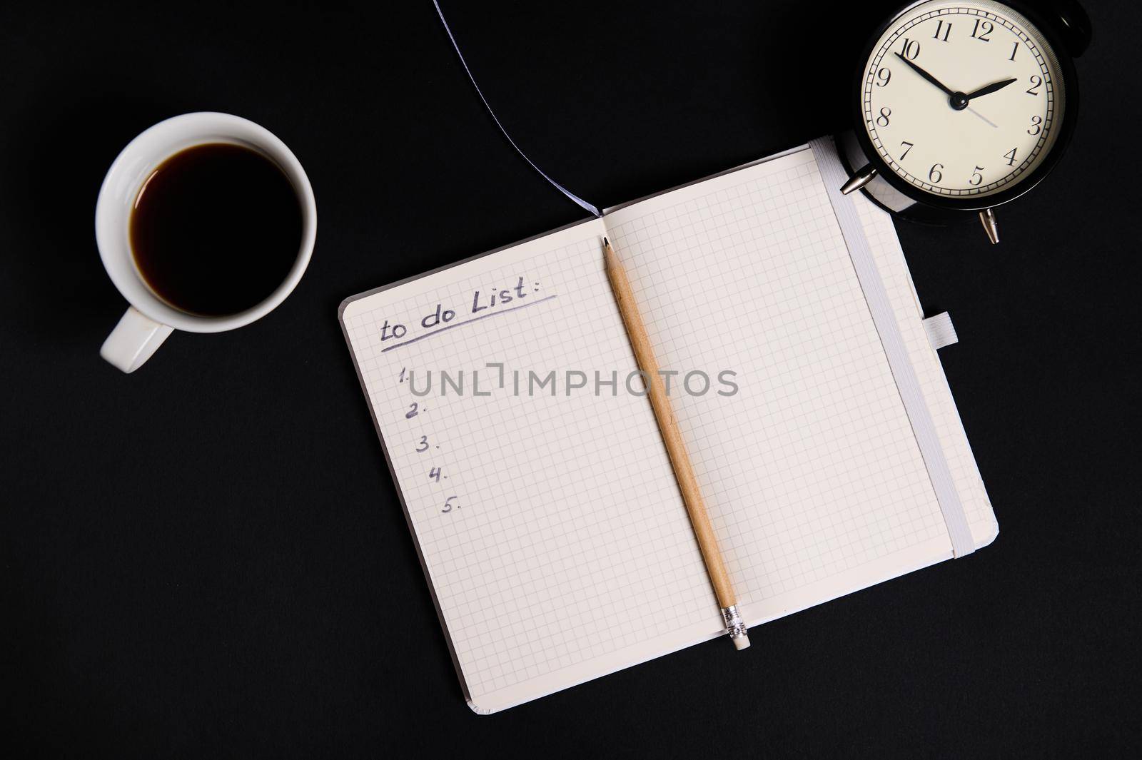 Flat lay of an opened organizer, notepad with list to do on blank white sheets, cup of coffee and alarm clock on black background with copy space. Business, Organization, Time Management concepts.. by artgf