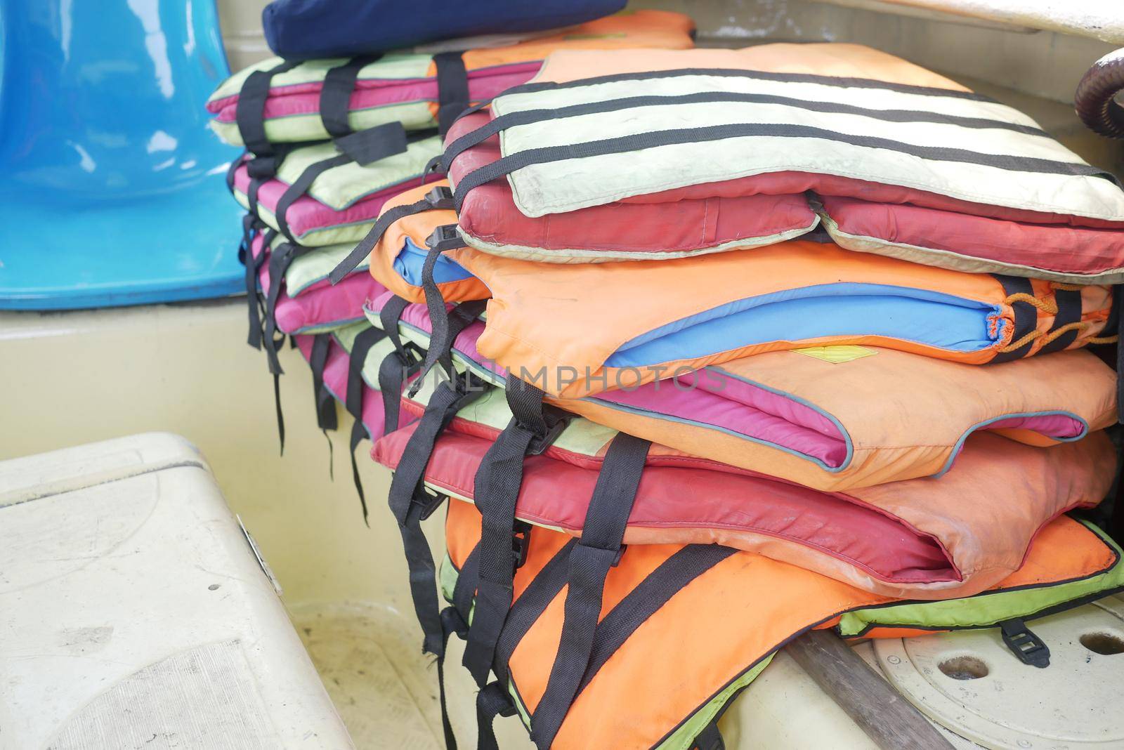 stack of life jacket in a boat .