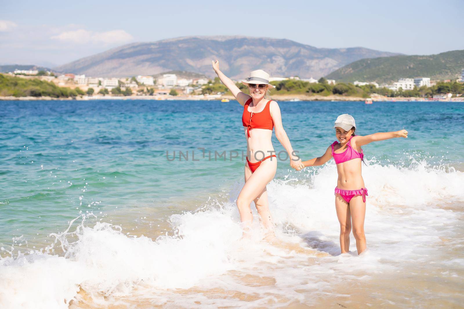 little girl and her mother have a good time at the seaside resort.