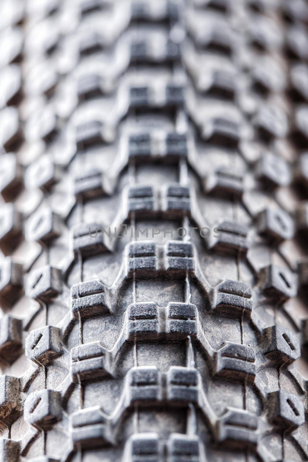 Bicycle wheel and tire close up on tread abstract. Macro.