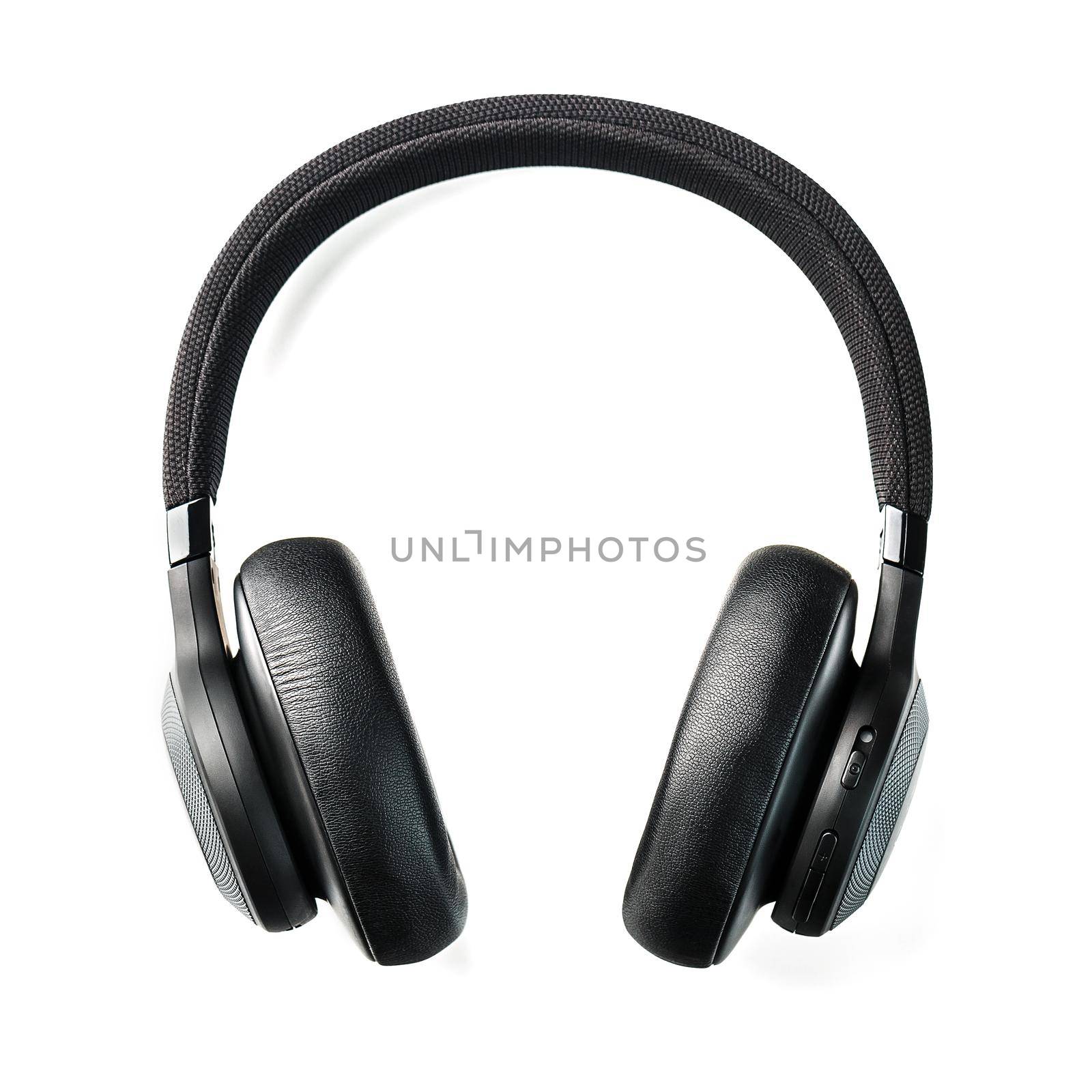 Black wireless headphones on a white background. Overhead, isolated professional-grade headphones for DJs and musicians. Top view, isolate