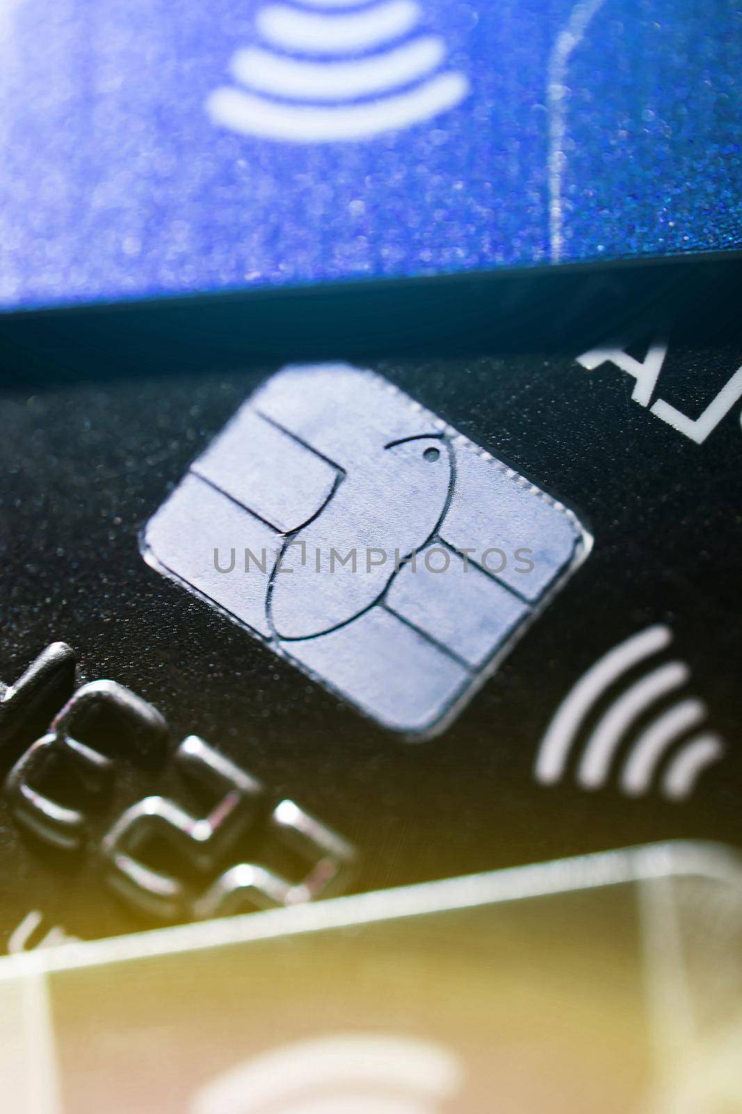 Electronic contactless credit card with selective focus microchip. Macro of a credit card. Contactless payments