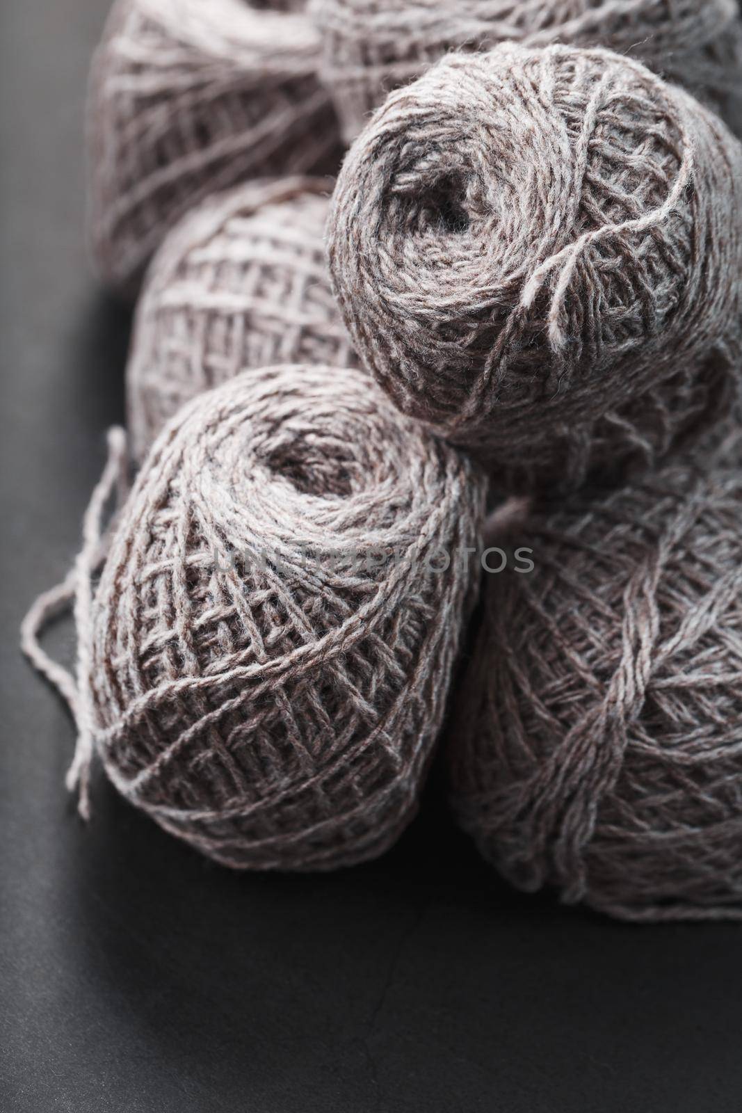 Light brown yarn made of natural sheep wool. Needlework