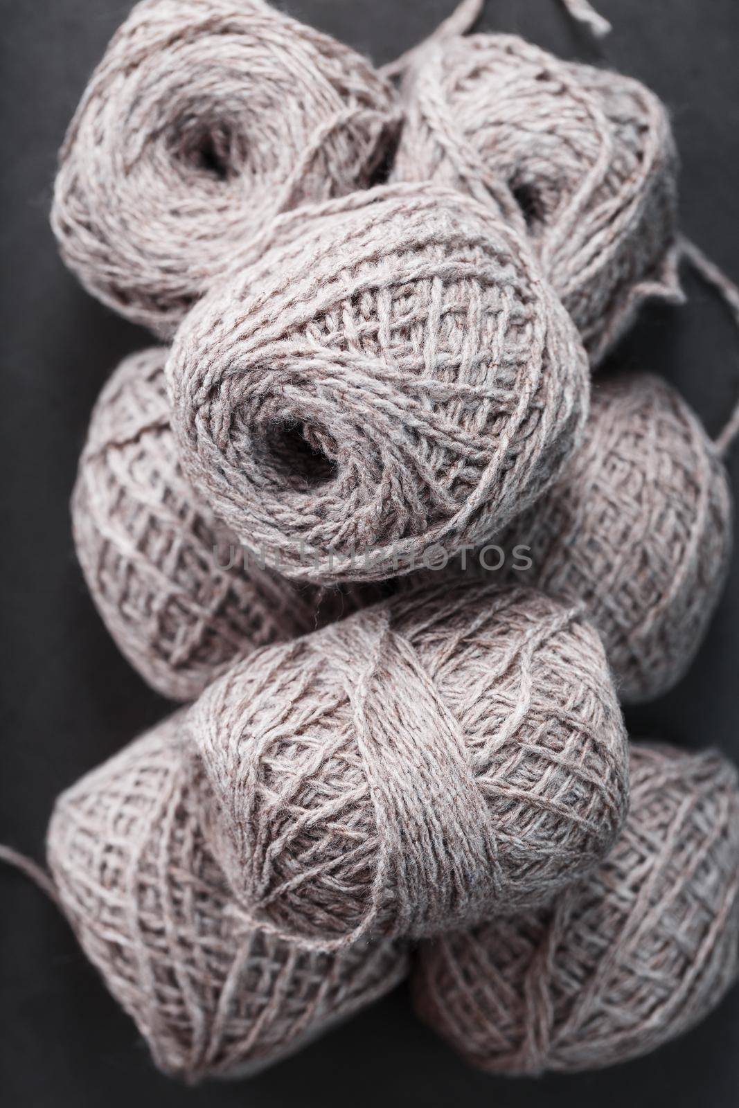 Light brown wool yarn made of threads in tangles. Needlework