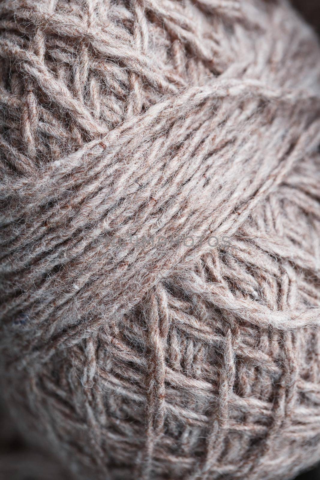 Balls of brown wool yarn made of natural wool. Needlework