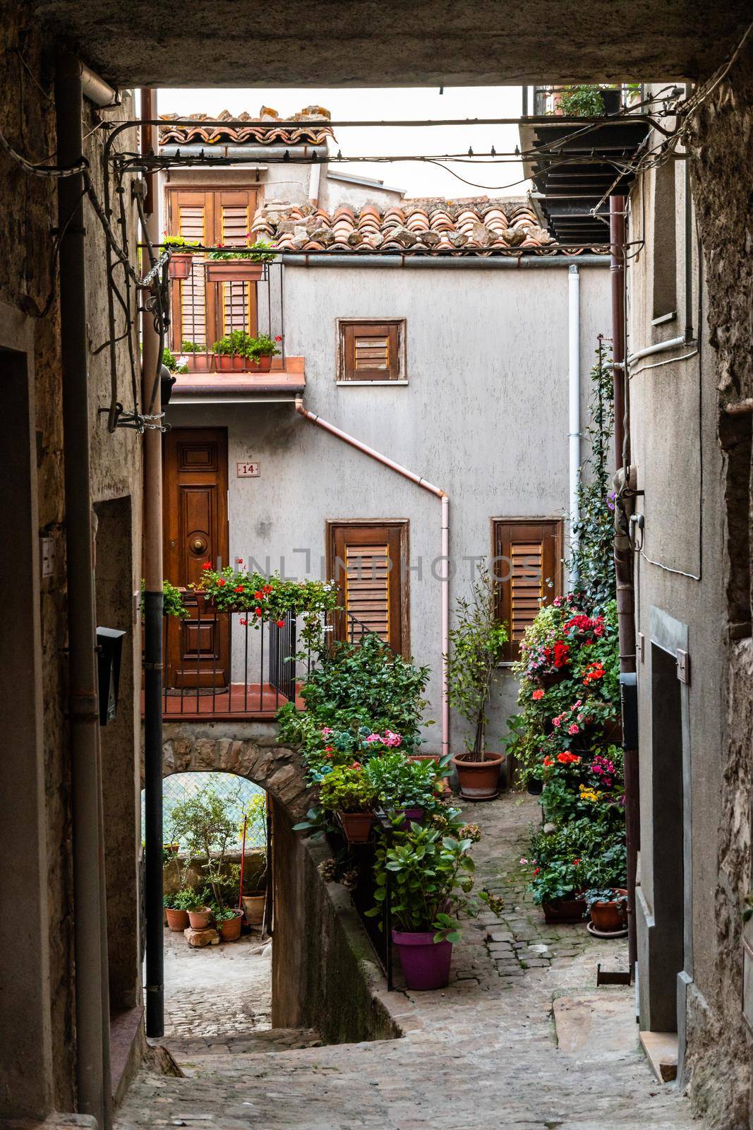 Rural houses and narrow streets in the medieval village Geraci Siculo, Italy by mauricallari