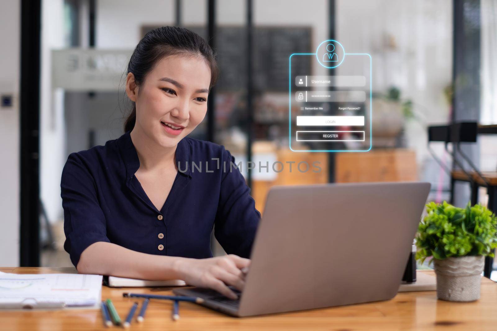 Business Finance and Accounting Concept. Business woman using security application on laptop computer to protect her money. by itchaznong
