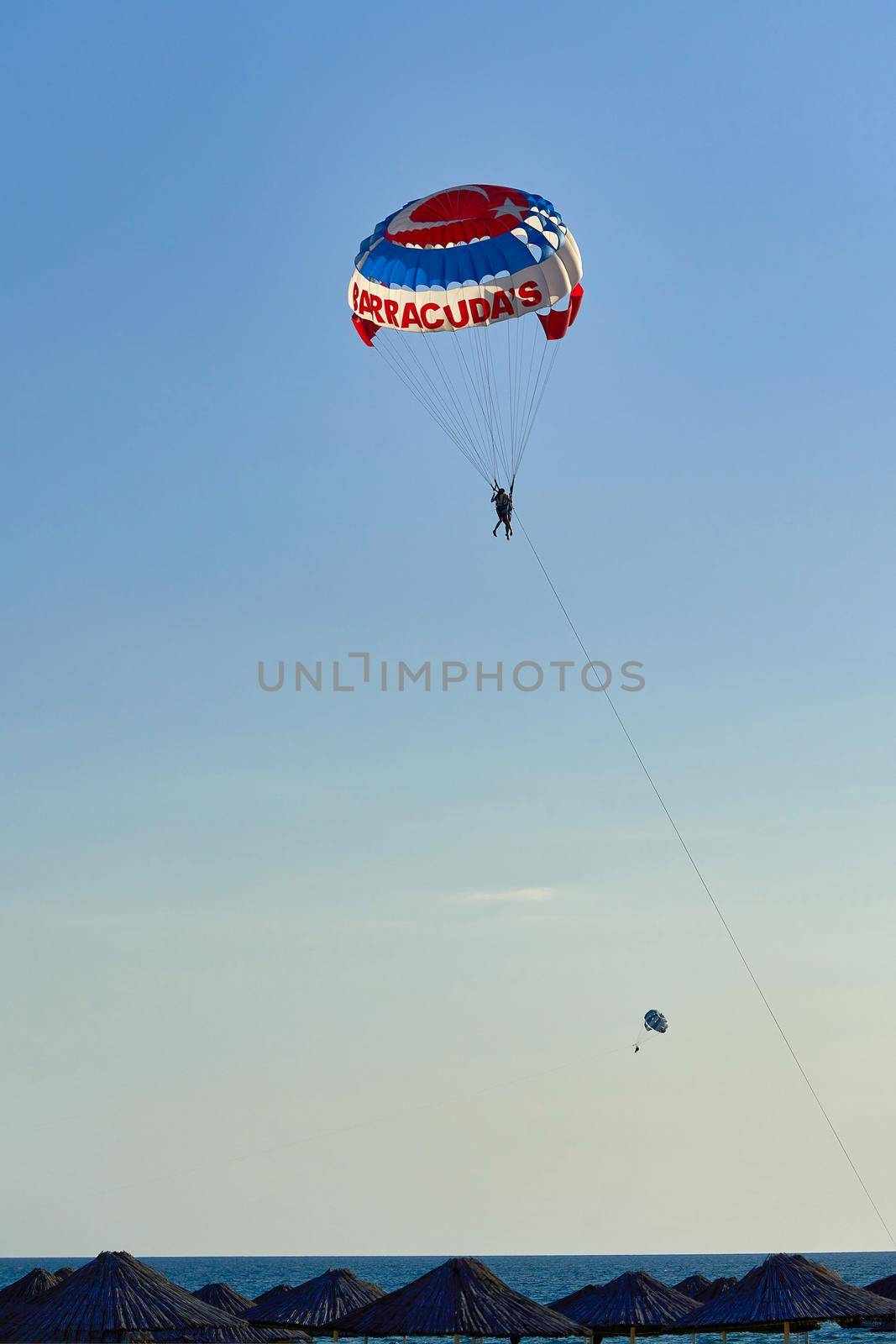 Parachute over the sea, resort water activities. Extreme vacation by the sea