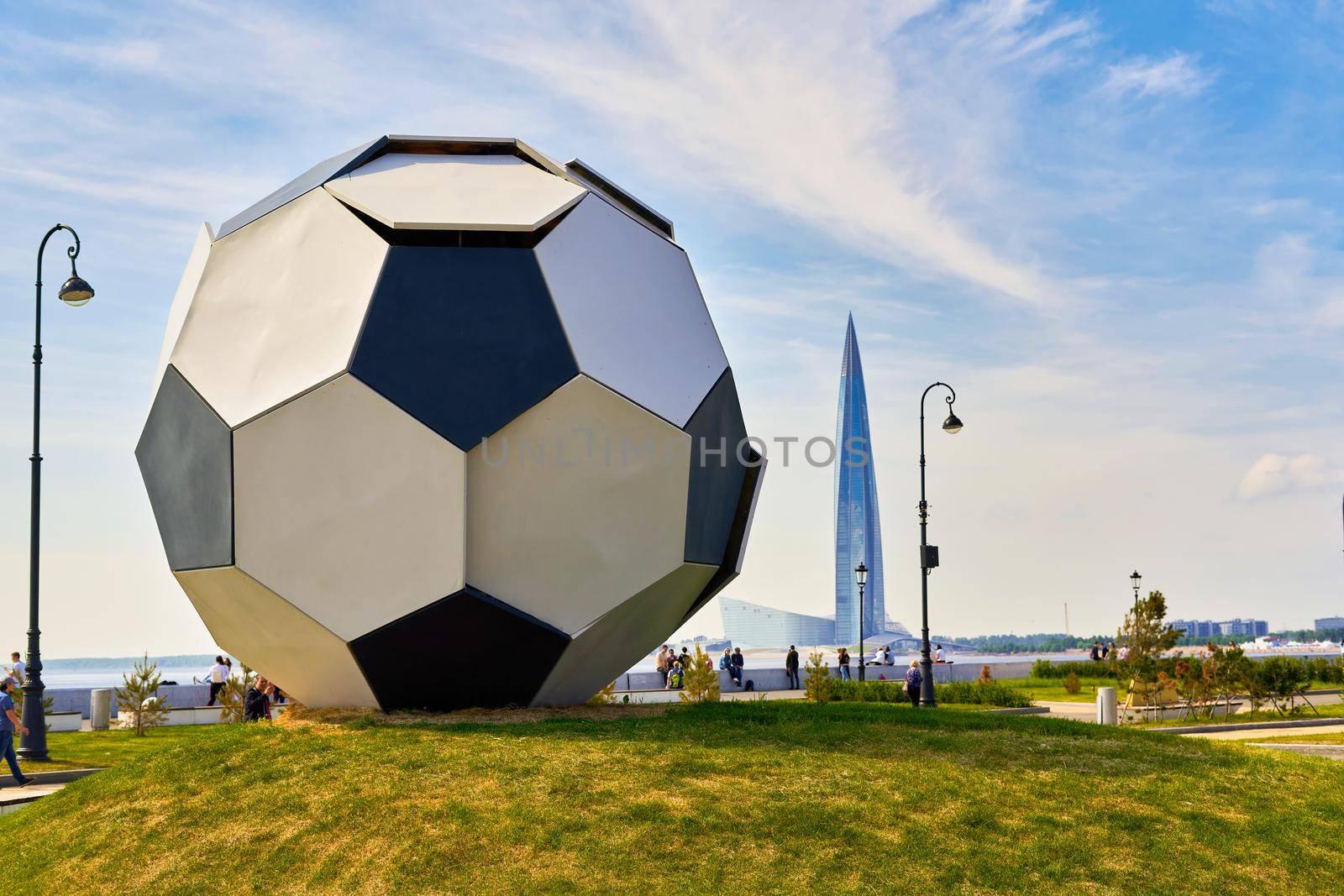 A huge ball against the background of the Lakhta Center near the Zenit stadium. Close up