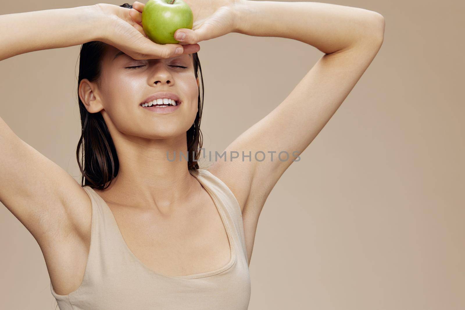 portrait woman green apple near face health isolated background by SHOTPRIME