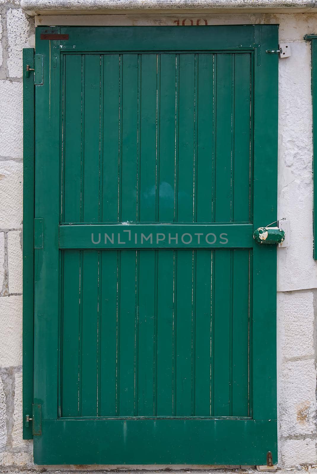 Old entrance wooden green door. Antique wooden green door by PhotoTime