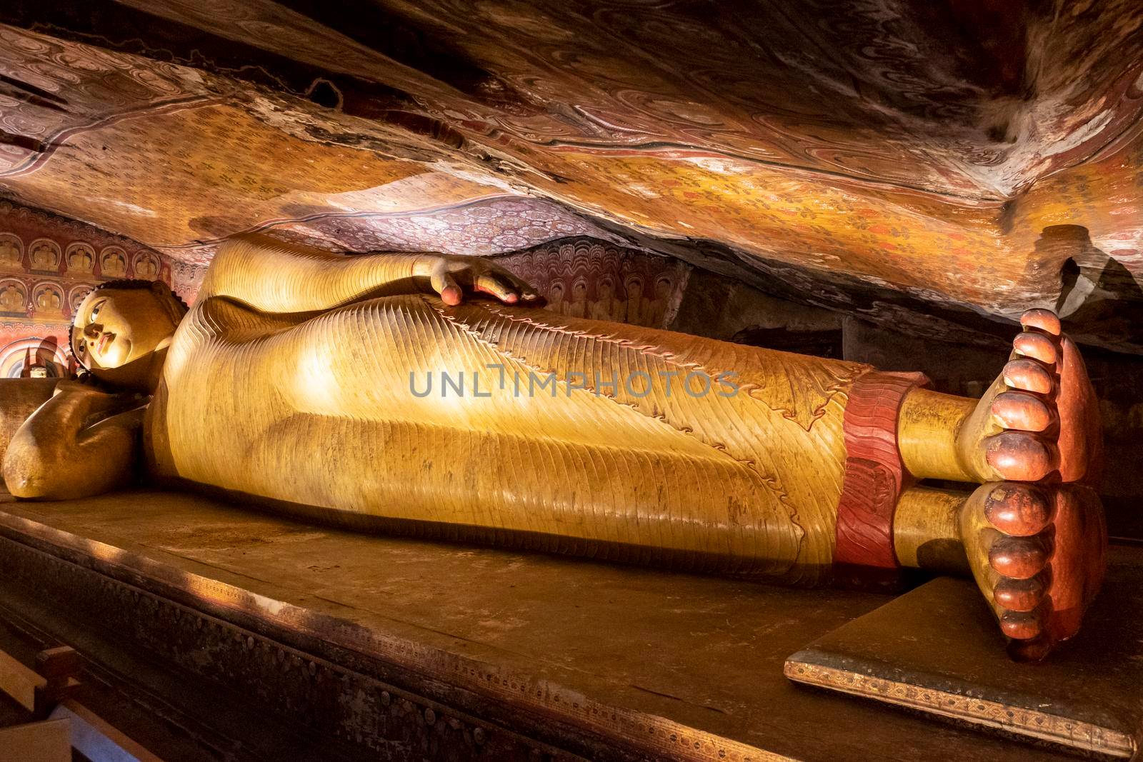 Sri Lanka. Dambulla Cave Temple. Lying Buddha statue in close-up. High quality photo