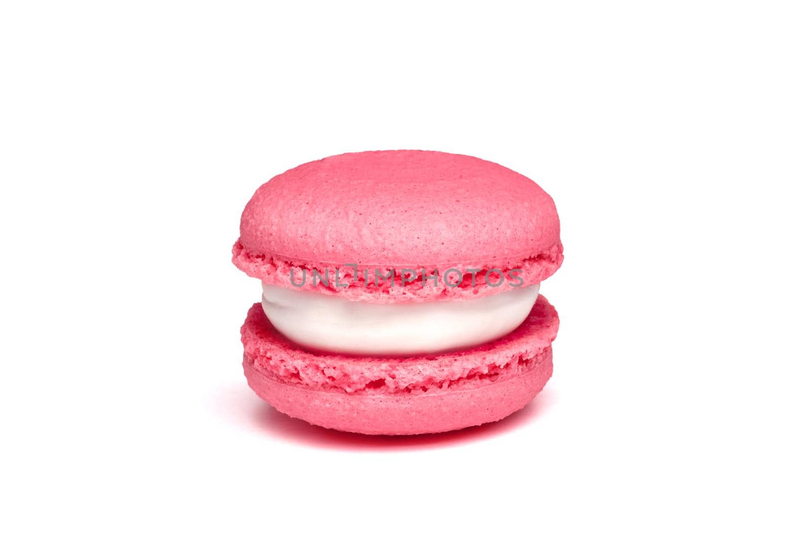 Pink strawberry or raspberry macaroon isolated on white background. French cookie by lavsketch