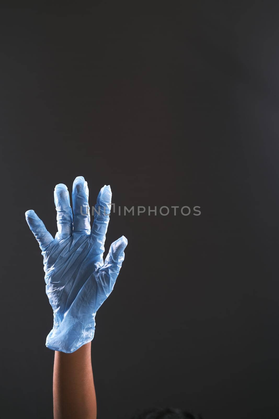 man doctor with medical gloves isolated on black .