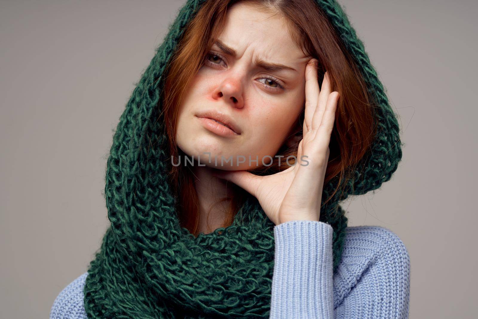 red-haired woman green scarf on the head isolated background. High quality photo