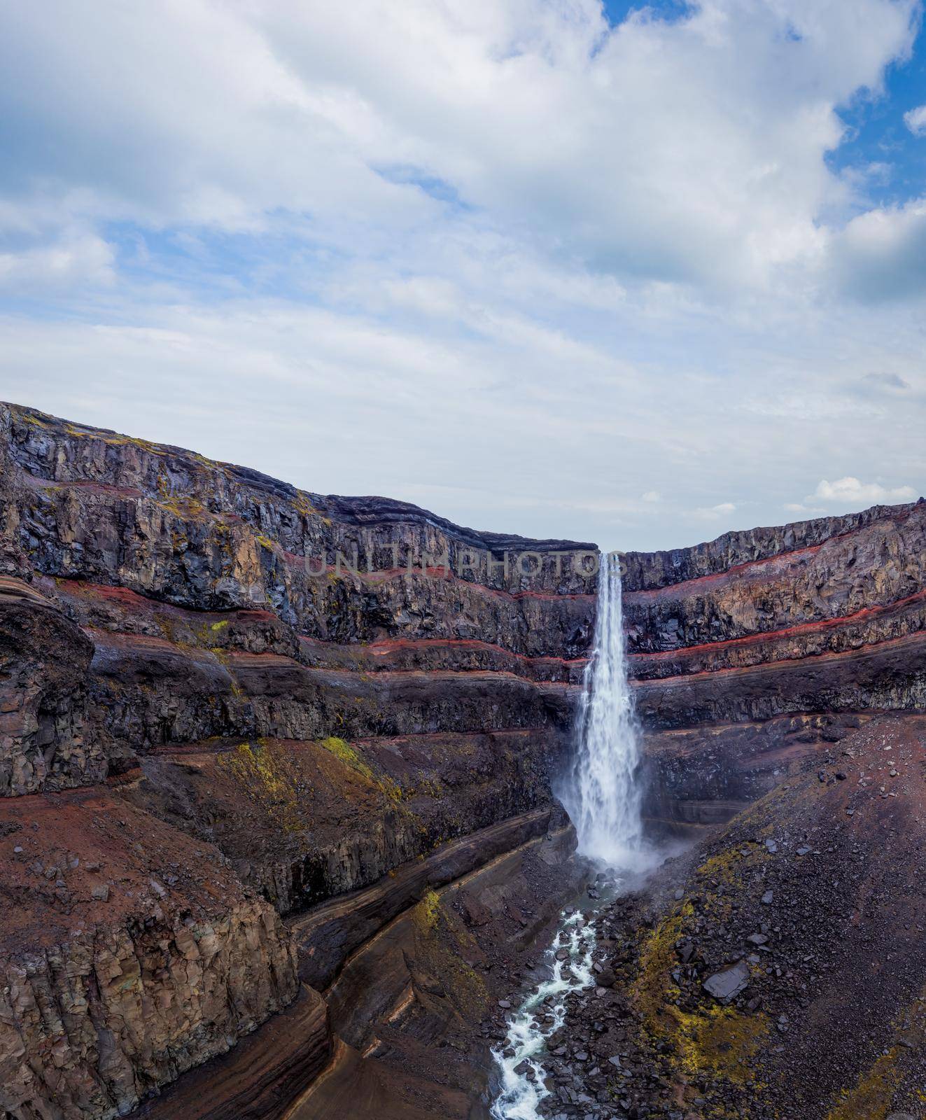 Famous Svartifoss waterfall panorama under cloudy sky in Iceland