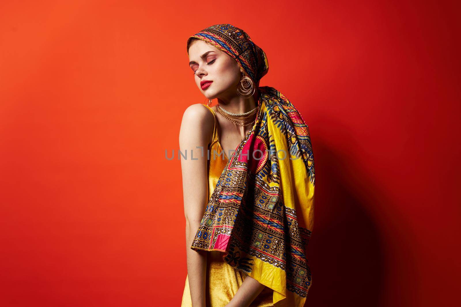 pretty woman multicolored shawl ethnicity african style red background by SHOTPRIME