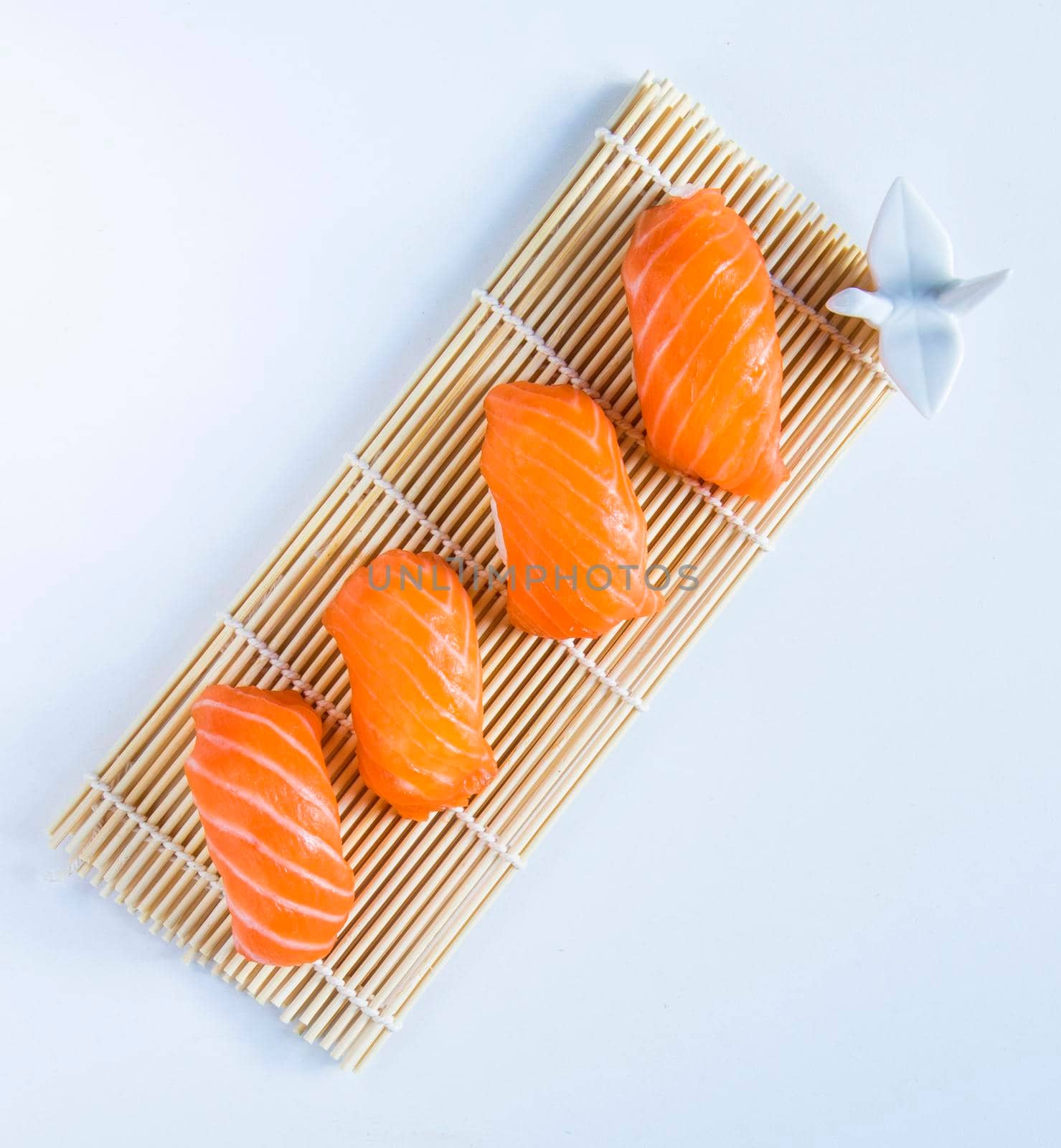 Salmon fish nigiri set on the white background by Taidundua