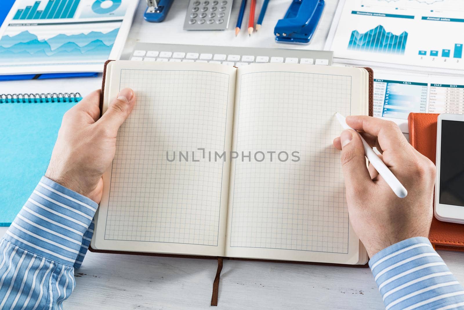 close-up of hands with notepad. office work