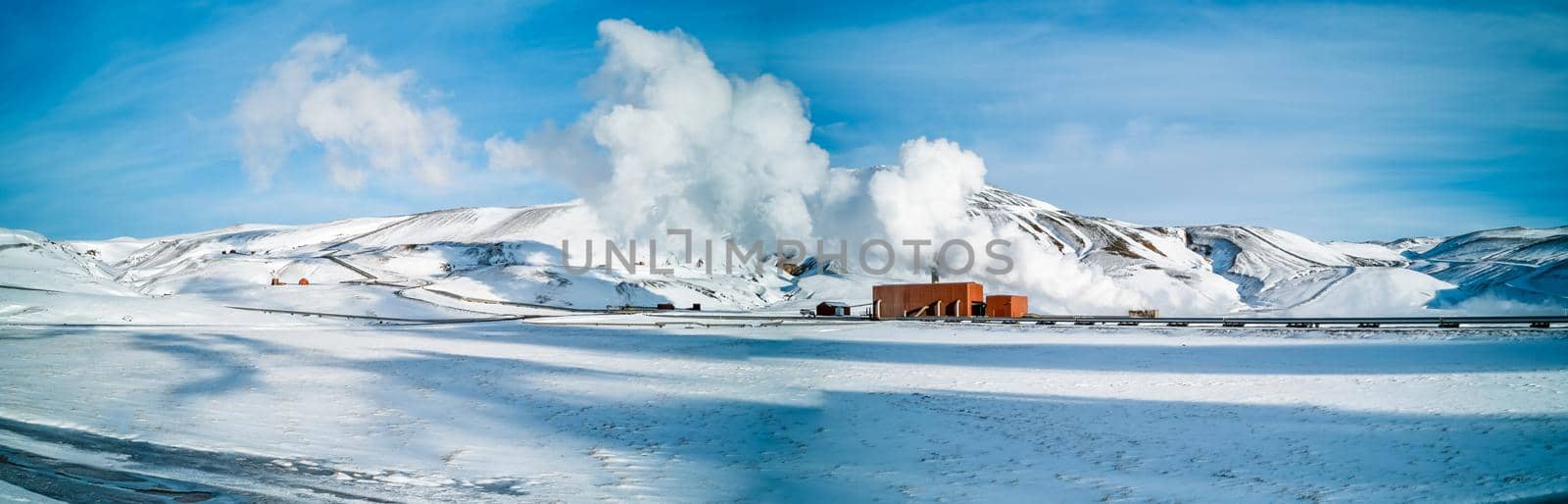 Geothermic energy plant over the snow, panorama by FerradalFCG