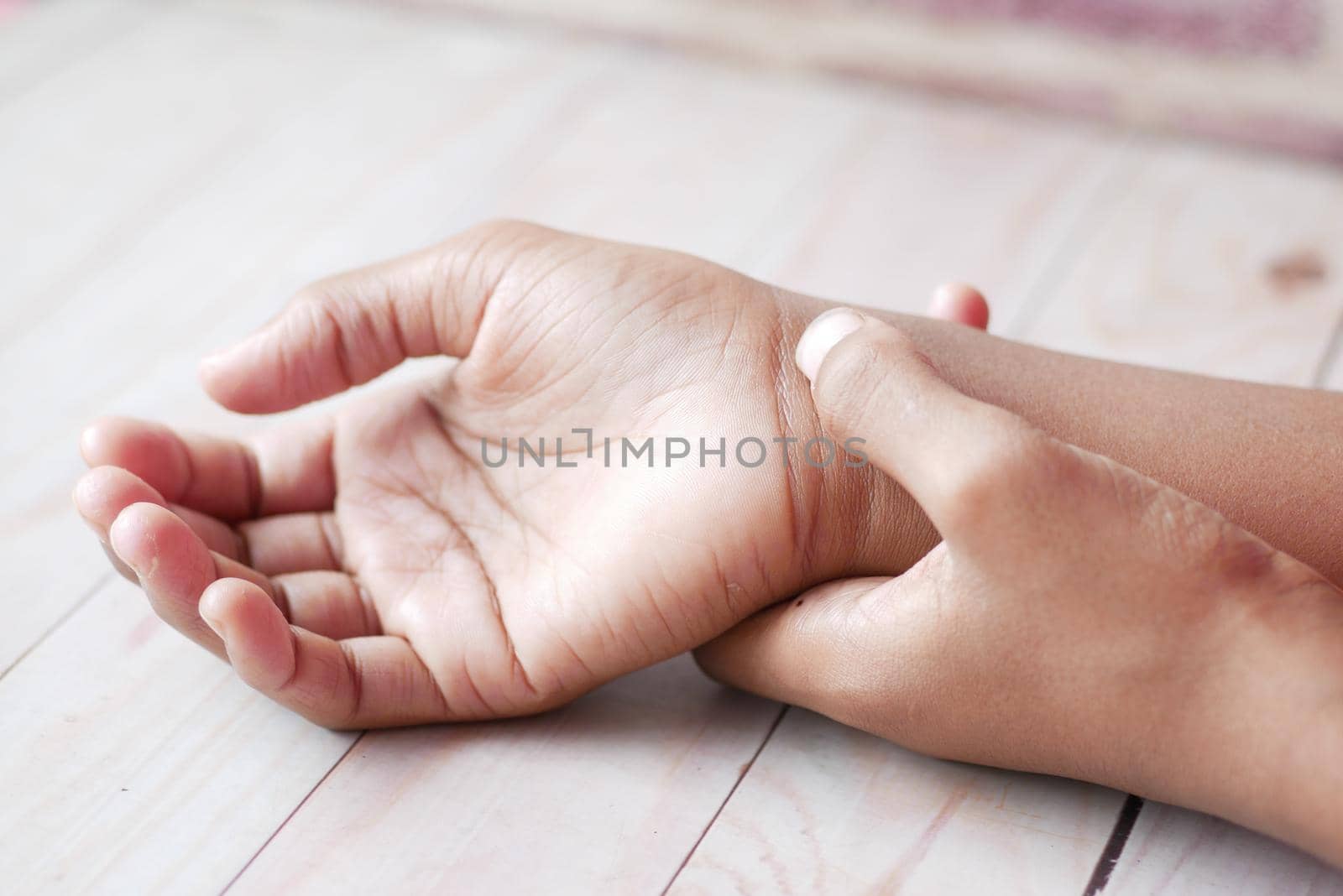 man suffering pain in hand close up .