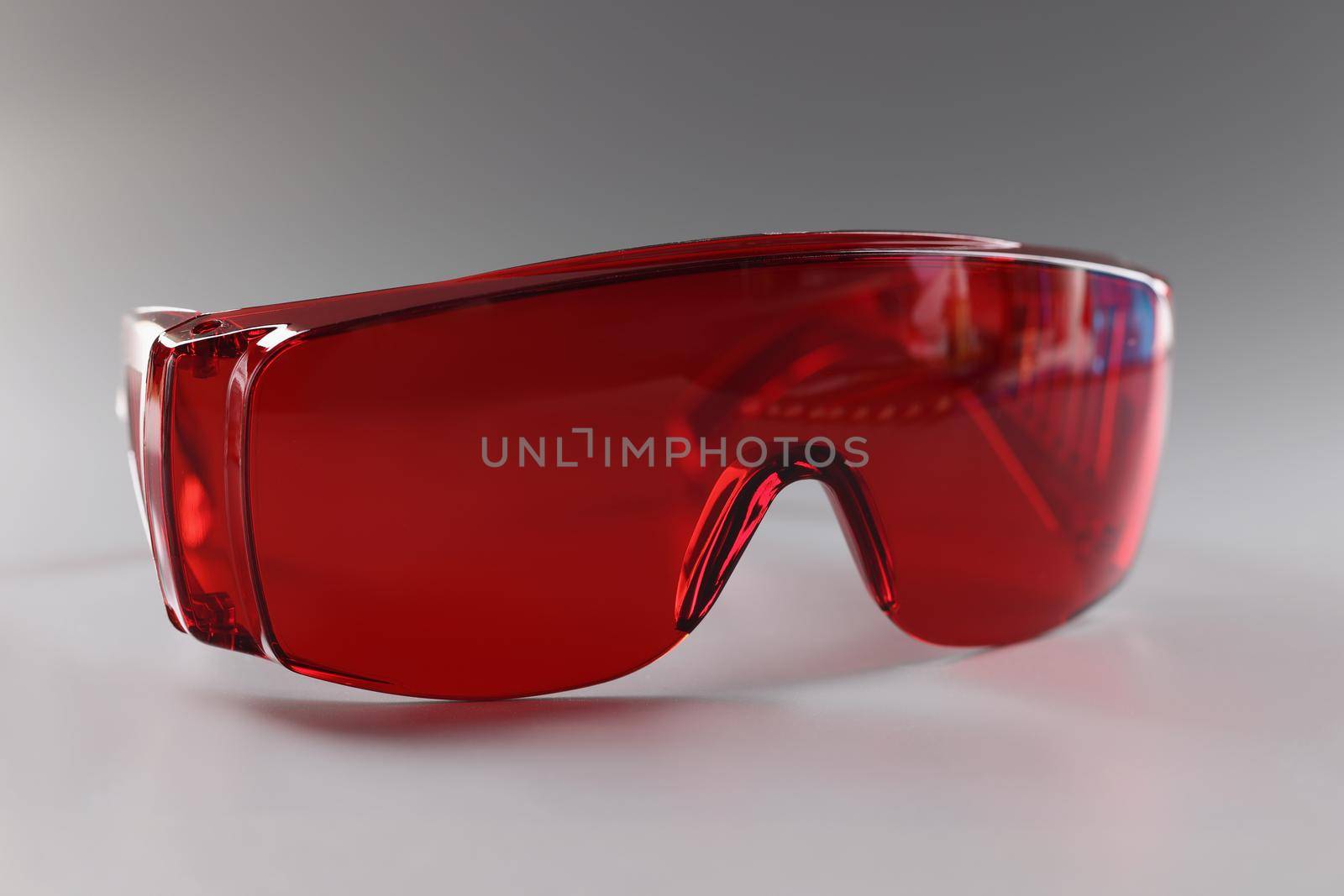 Red plastic safety glasses, protective workwear for human eyes by kuprevich