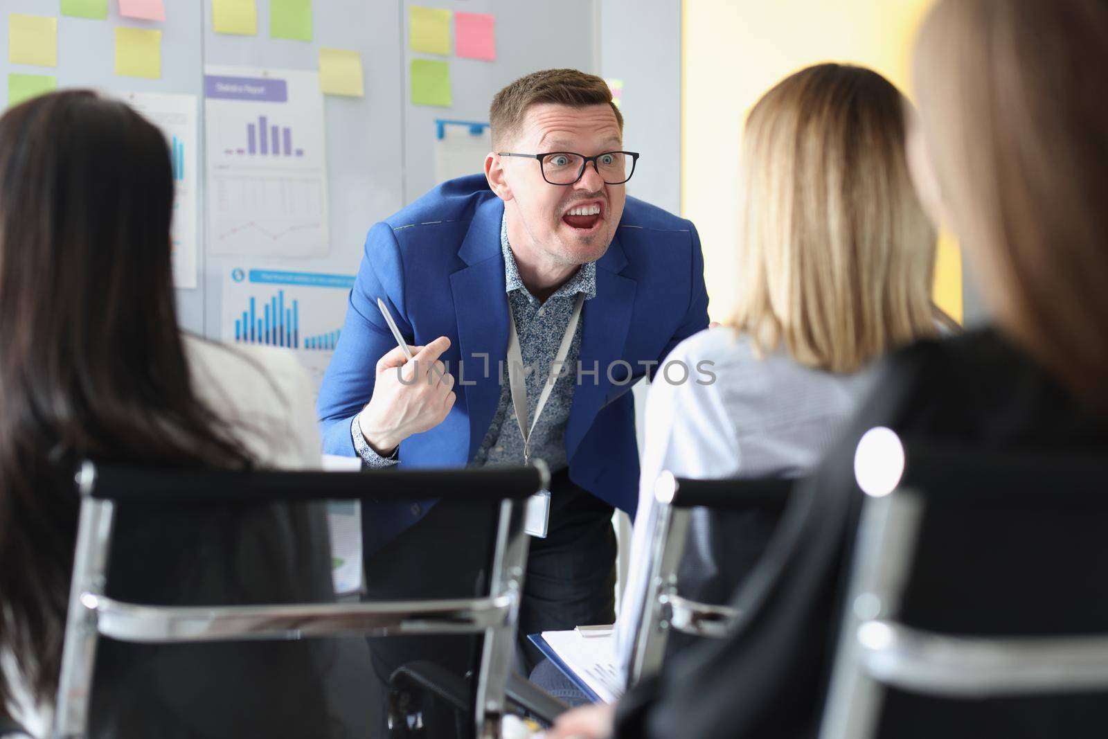 Portrait of serious man scream on training session, passionate speech with bright emotions. Training for company workers, skills development, class concept