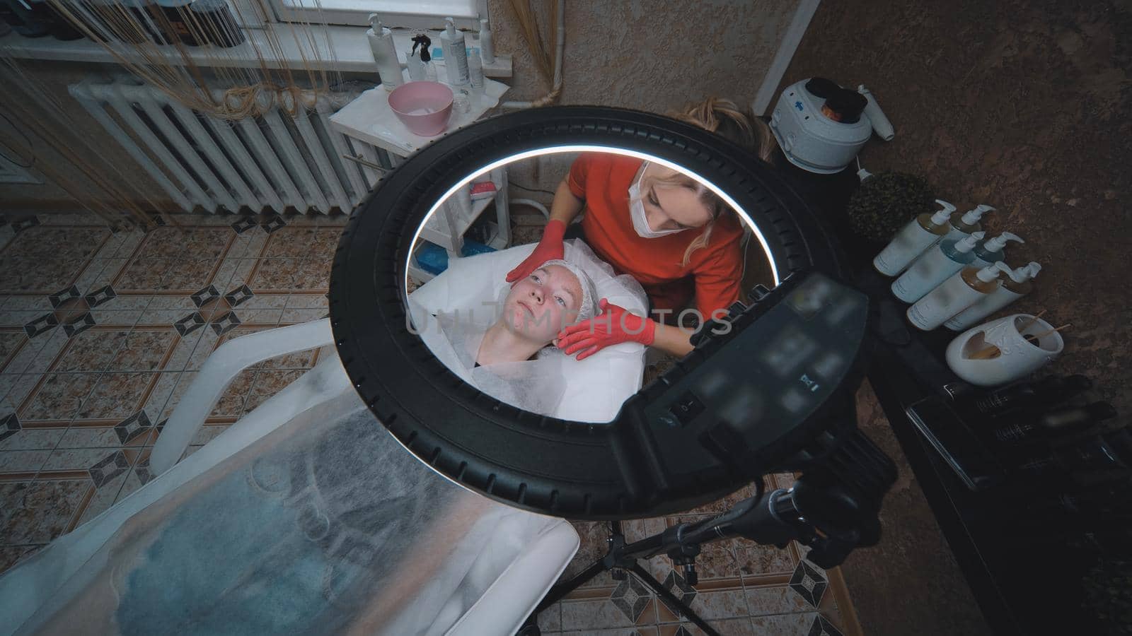 Woman beautician works with a client in a cosmetology office