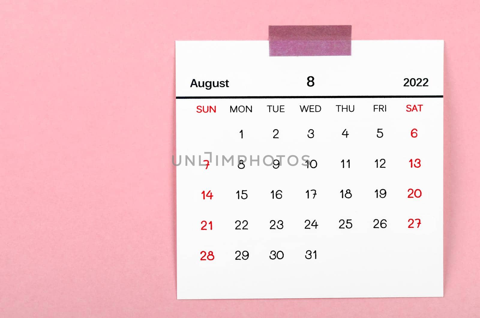 The August 2022 calendar on pink background.