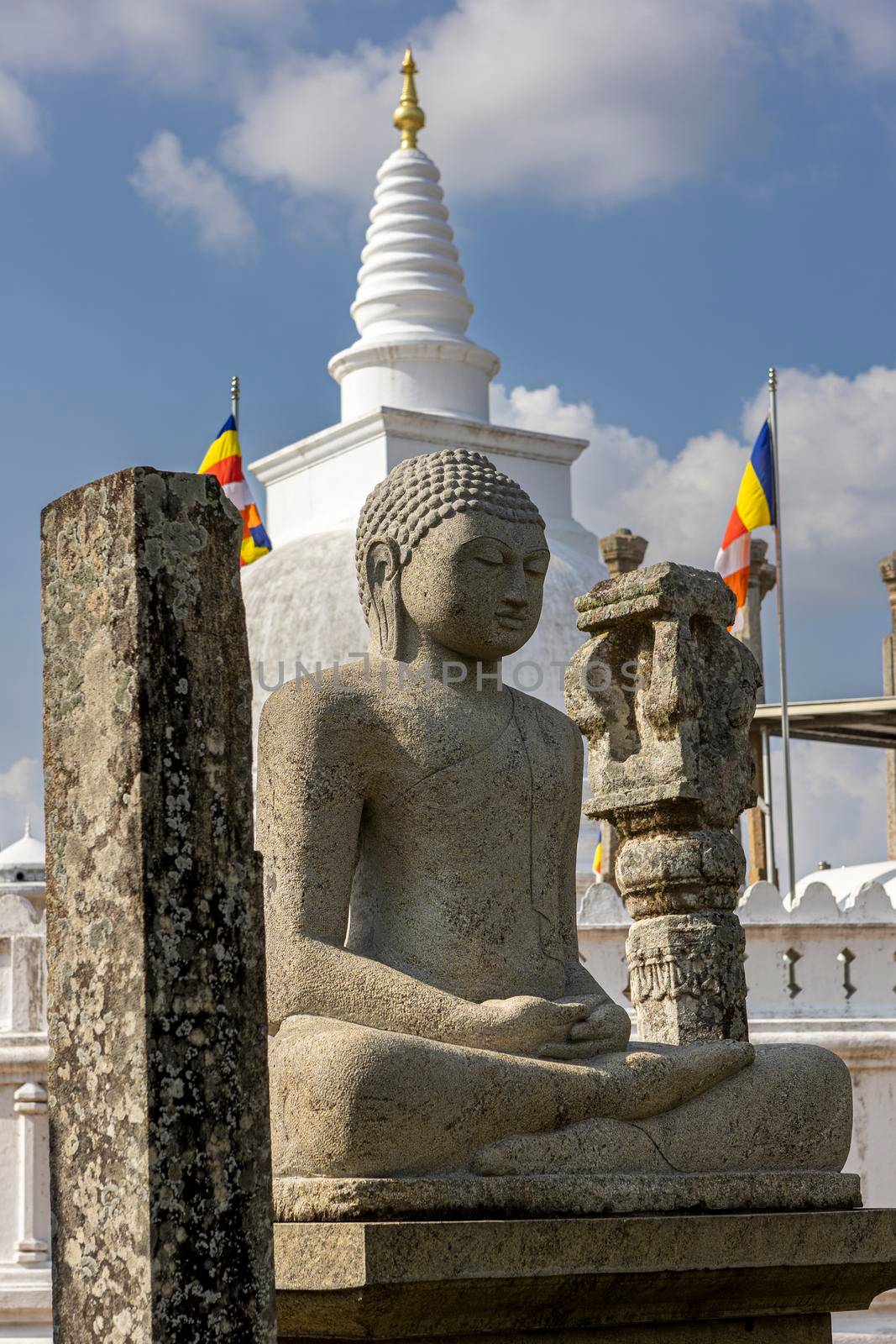 Sri Lanka. Anuradhapura. Thuparamaya Stupa is the earliest Dagoba to be constructed in the island. A statue of a sitting Buddha. High quality photo