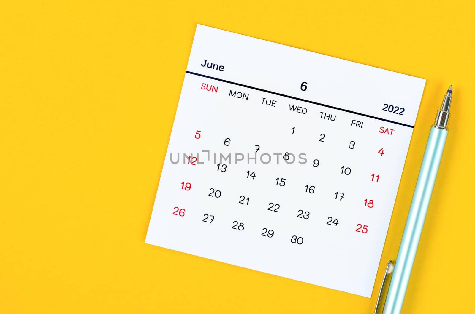 The June 2022 calendar on yellow background.