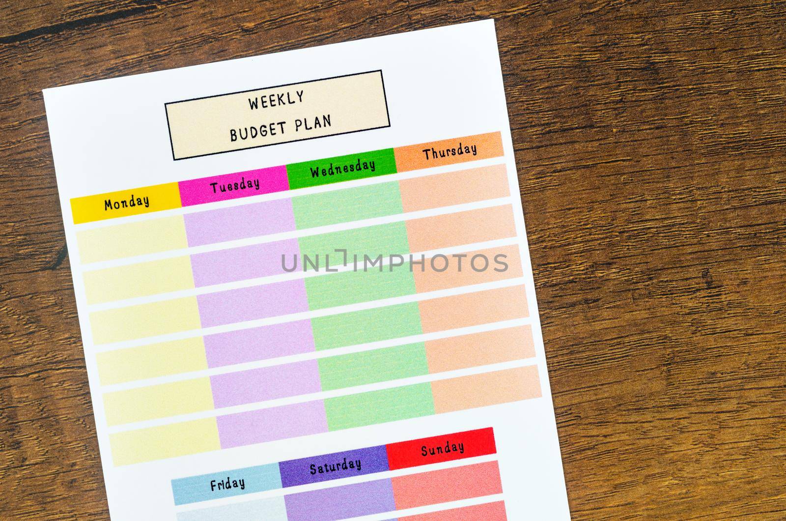 Weekly budget plan form on wooden background.
