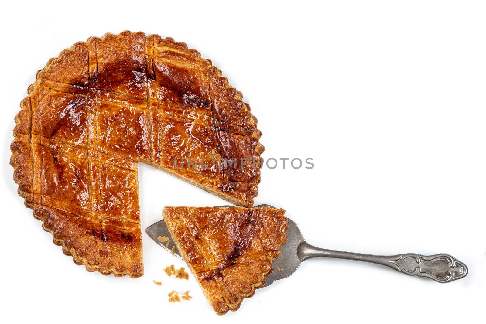 galette des rois and crown on a table, king epiphany cake isolated on white background