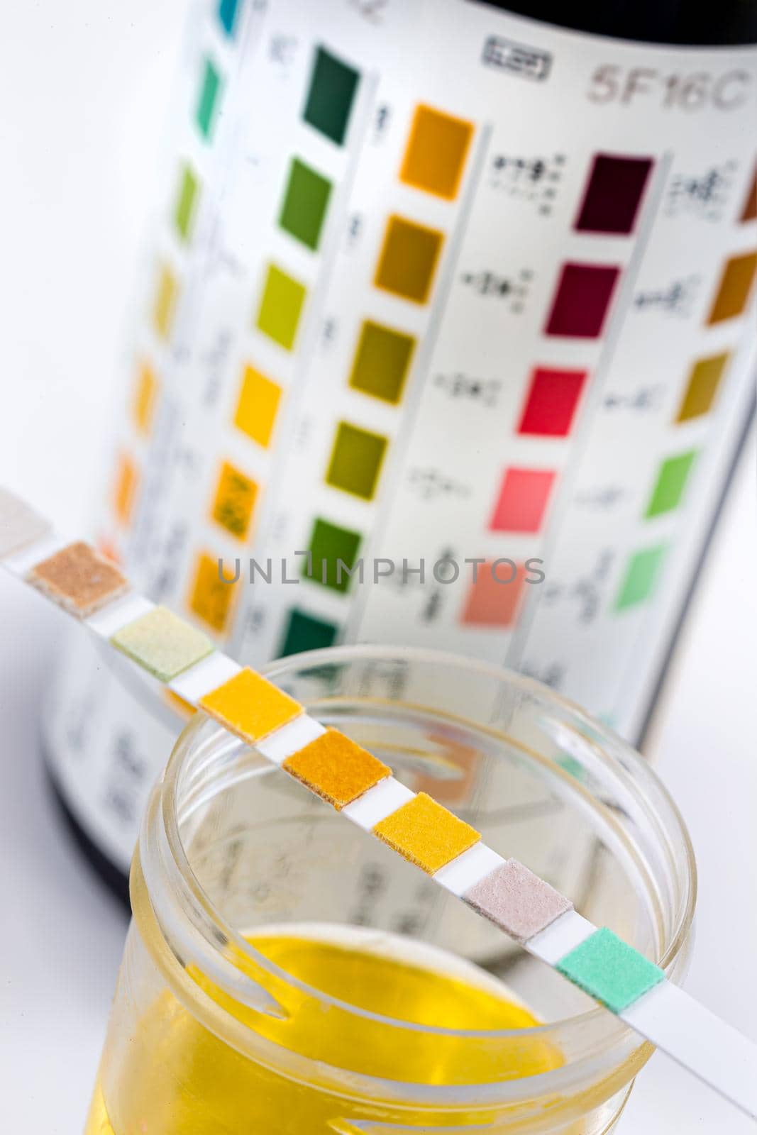 strip placed on the vials of urine close up view