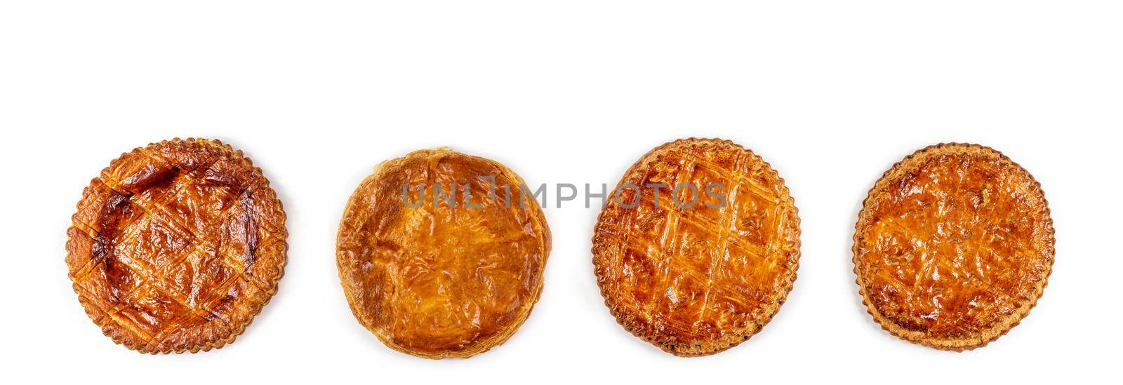 Panoramic of cakes aligned on a white background